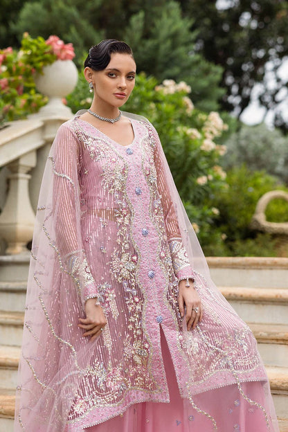 Stylish light pink dress with embroidered net shirt, sequined dupatta, embellished trouser, silk neckline, and handmade tassels for an elegant look.