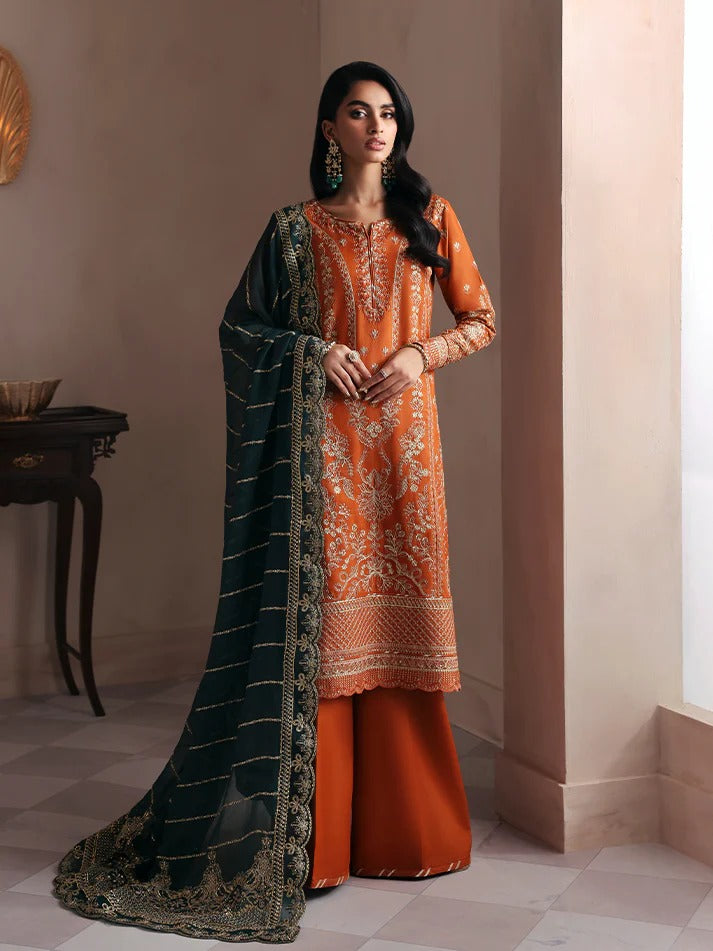 Grace your wardrobe with this embroidered and sequined raw silk outfit featuring detailed panels, chiffon dupatta with organza border, and dyed silk trousers.