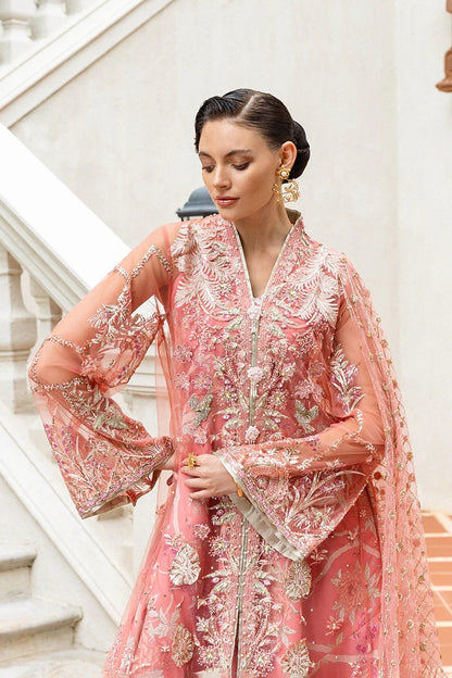 Elegant coral dress with embroidered net shirt, sequined dupatta, raw silk trouser, 3D bird embellishments, and handmade tassels for luxury style.