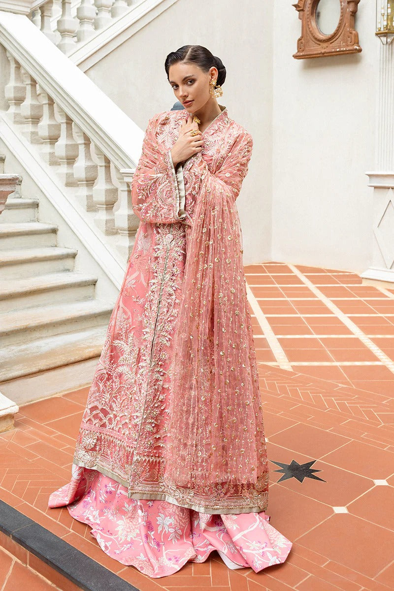 Elegant coral dress with embroidered net shirt, sequined dupatta, raw silk trouser, 3D bird embellishments, and handmade tassels for luxury style.