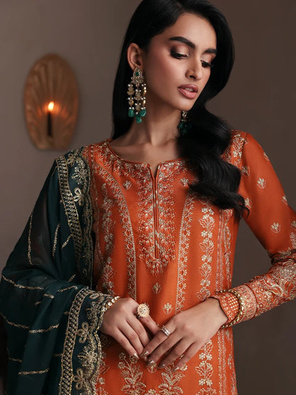 Grace your wardrobe with this embroidered and sequined raw silk outfit featuring detailed panels, chiffon dupatta with organza border, and dyed silk trousers.