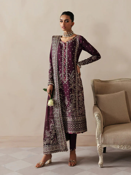 Luxurious raw silk outfit featuring embroidered and sequined panels, elegant chiffon dupatta with organza motifs, and matching dyed silk trouser.