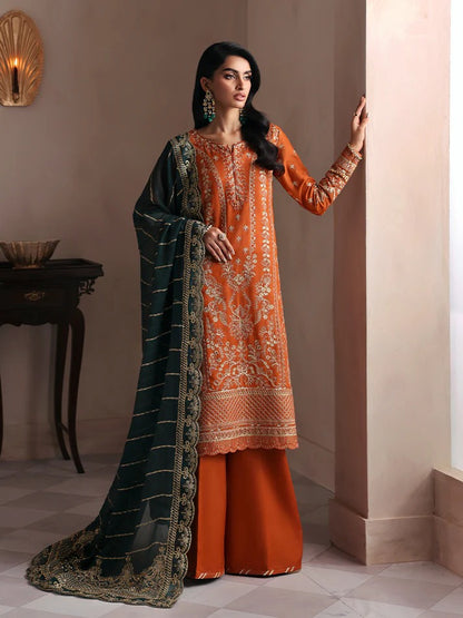 Grace your wardrobe with this embroidered and sequined raw silk outfit featuring detailed panels, chiffon dupatta with organza border, and dyed silk trousers.