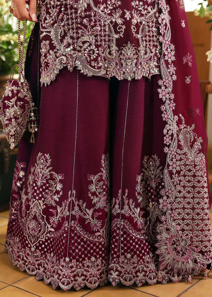 Regal imperial plum suit with hand-embellished organza panels, ornate borders, embroidered dupatta, and trouser for timeless festive elegance.