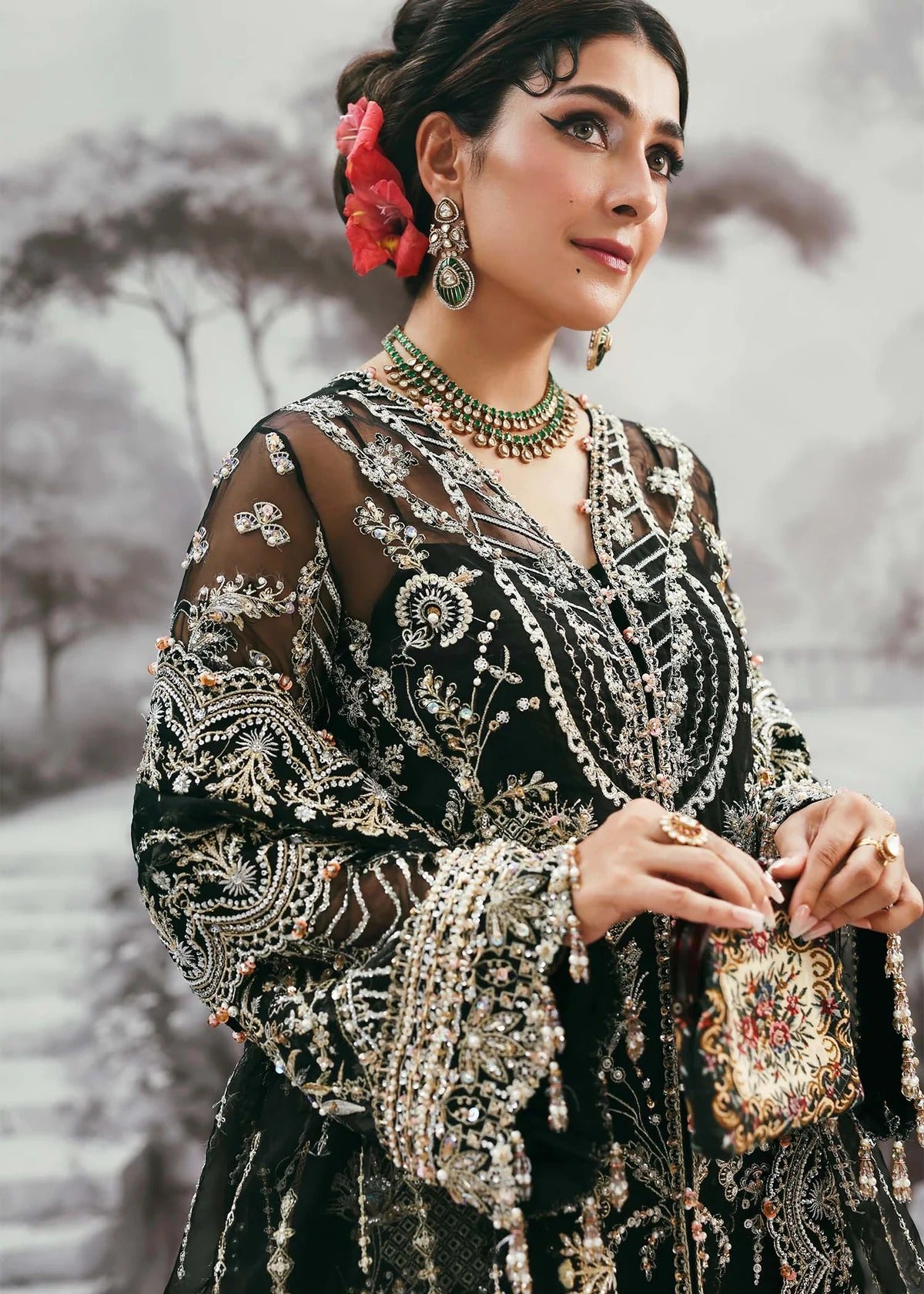 Majestic onyx noir suit with hand-embellished organza panels, refined borders, embroidered dupatta, and sleek trouser for timeless evening elegance.