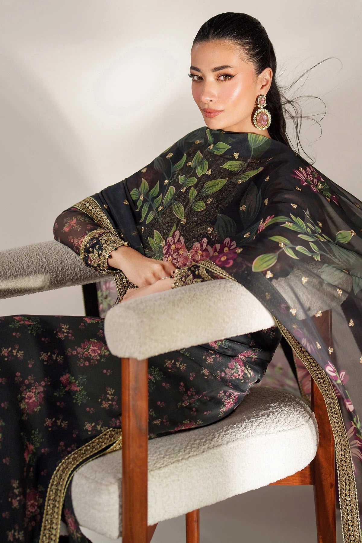Digitally printed chiffon suit with intricate embroidery, bordered dupatta, and raw silk bottom—perfect for a graceful, formal, and timeless look.