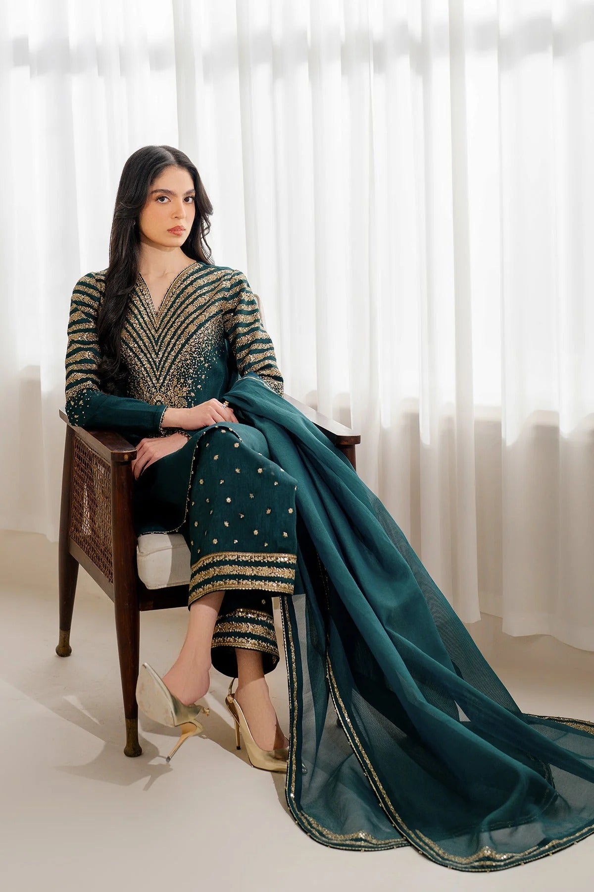 UR-7056 features embroidered Korean rawsilk front, sleeves, and bottom with a check woven organza dupatta—crafted for elegant, formal occasions.