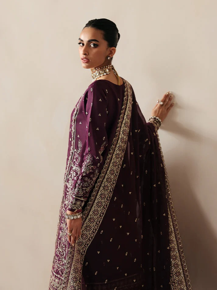 Luxurious raw silk outfit featuring embroidered and sequined panels, elegant chiffon dupatta with organza motifs, and matching dyed silk trouser.