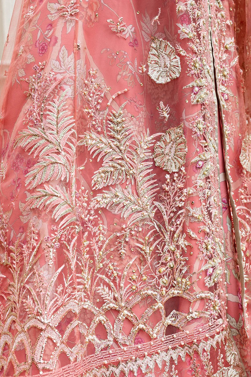 Elegant coral dress with embroidered net shirt, sequined dupatta, raw silk trouser, 3D bird embellishments, and handmade tassels for luxury style.