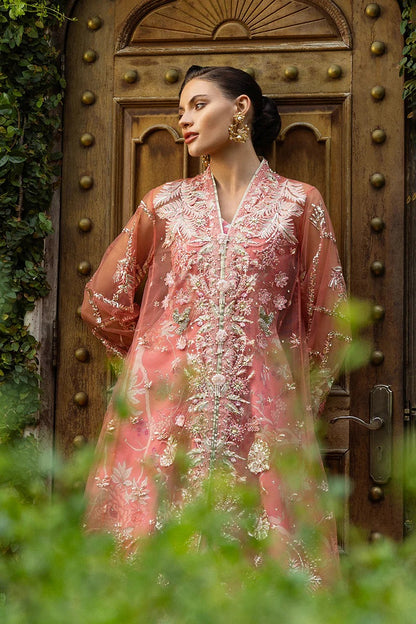 Elegant coral dress with embroidered net shirt, sequined dupatta, raw silk trouser, 3D bird embellishments, and handmade tassels for luxury style.