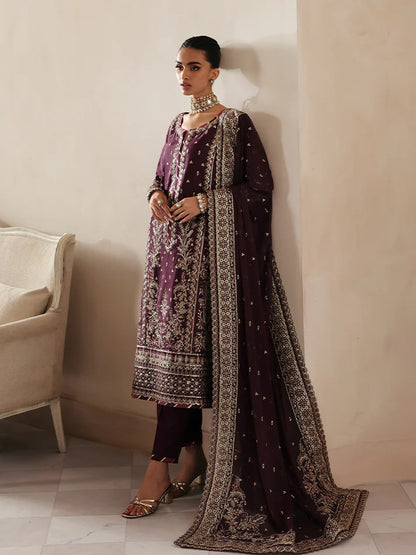 Luxurious raw silk outfit featuring embroidered and sequined panels, elegant chiffon dupatta with organza motifs, and matching dyed silk trouser.