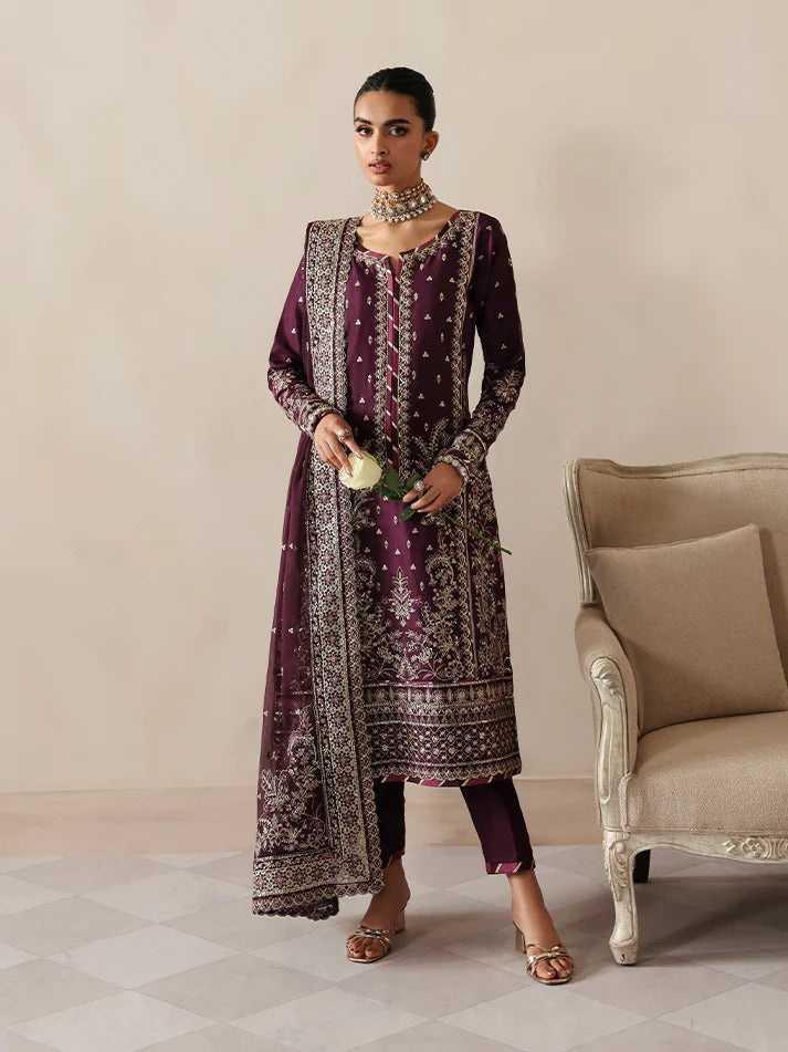Luxurious raw silk outfit featuring embroidered and sequined panels, elegant chiffon dupatta with organza motifs, and matching dyed silk trouser.