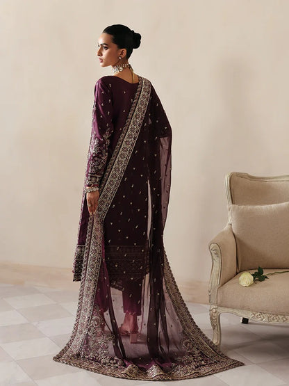 Luxurious raw silk outfit featuring embroidered and sequined panels, elegant chiffon dupatta with organza motifs, and matching dyed silk trouser.