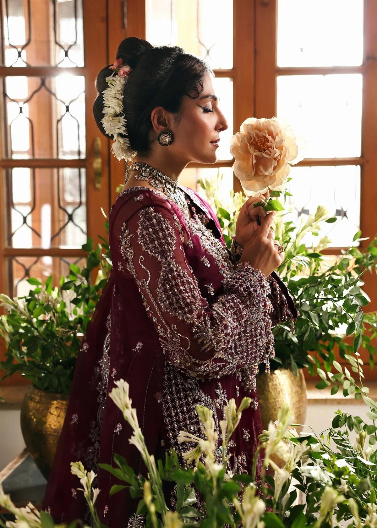 Regal imperial plum suit with hand-embellished organza panels, ornate borders, embroidered dupatta, and trouser for timeless festive elegance.