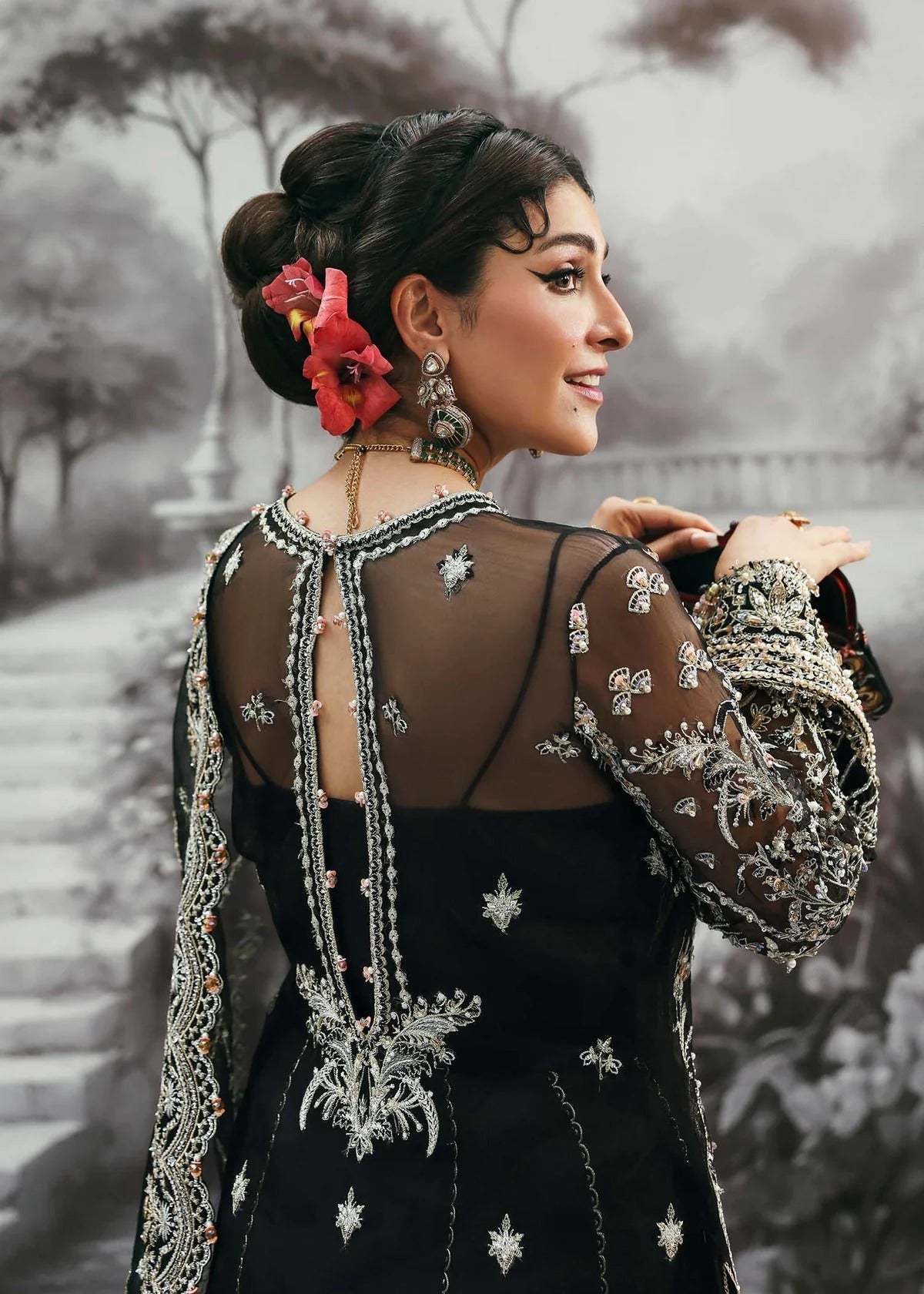 Majestic onyx noir suit with hand-embellished organza panels, refined borders, embroidered dupatta, and sleek trouser for timeless evening elegance.