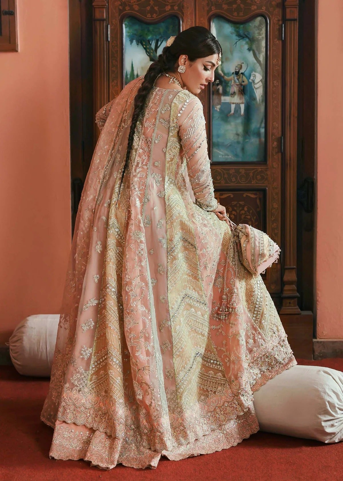 Stunning jewel-toned lehenga suit with hand-embellished shirt, embroidered borders, and organza dupatta for a regal festive look.