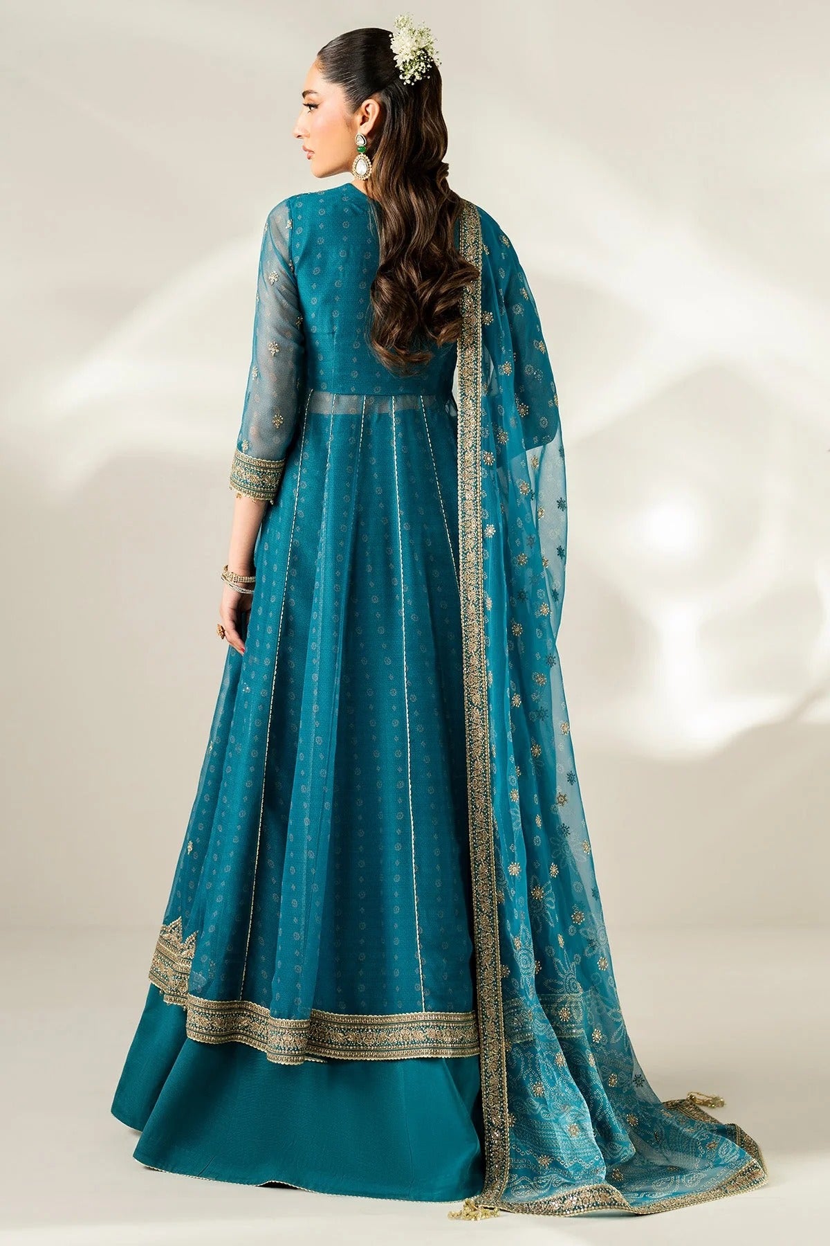 Digitally printed chiffon suit with embroidery on yoke, panels, sleeves & dupatta. Paired with dyed rawsilk bottom for a luxe, elegant formal look.