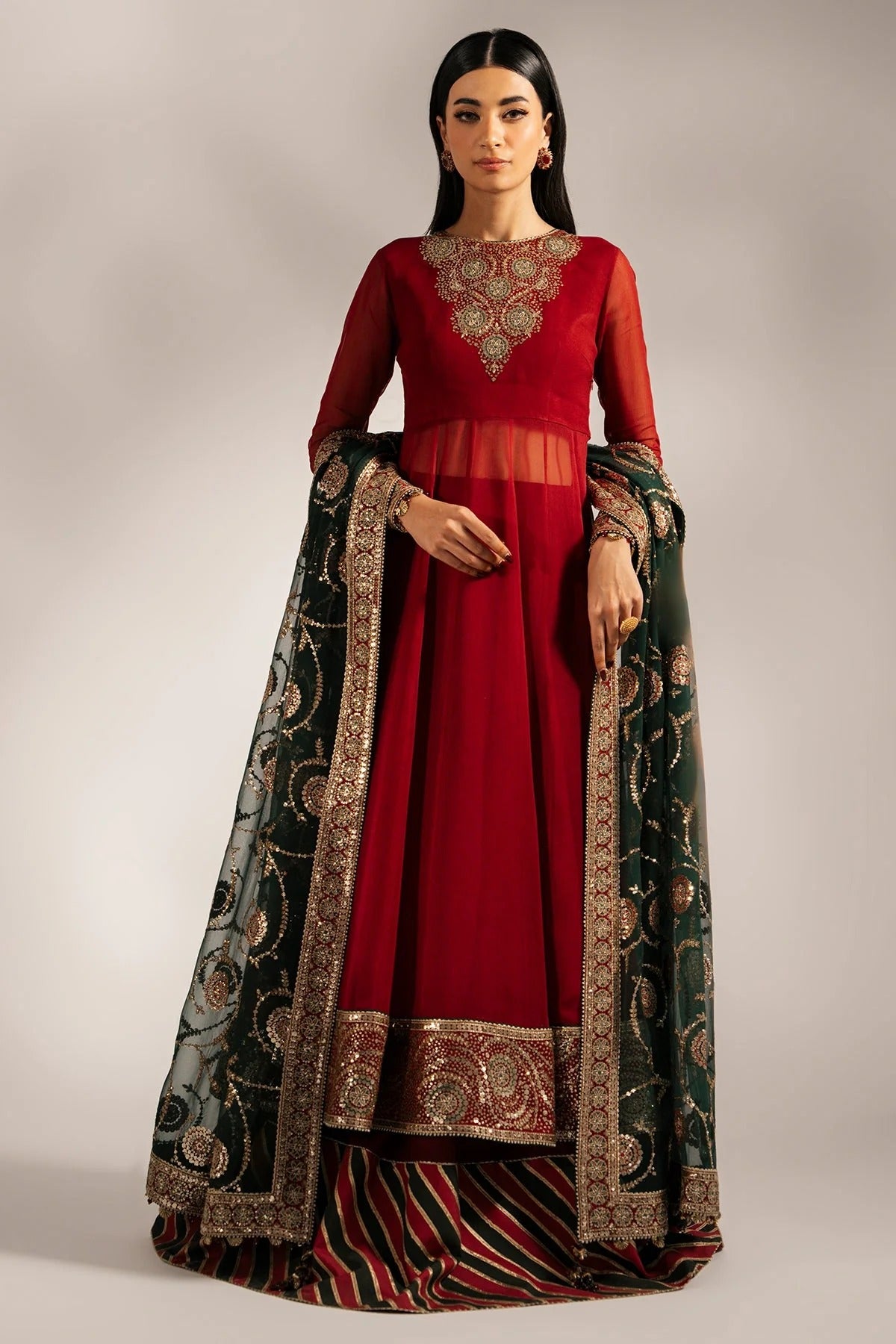 UC-3074 features embroidered chiffon yoke, dupatta, and borders with dyed chiffon panels and rawsilk bottom. A perfect pick for graceful, formal occasions.