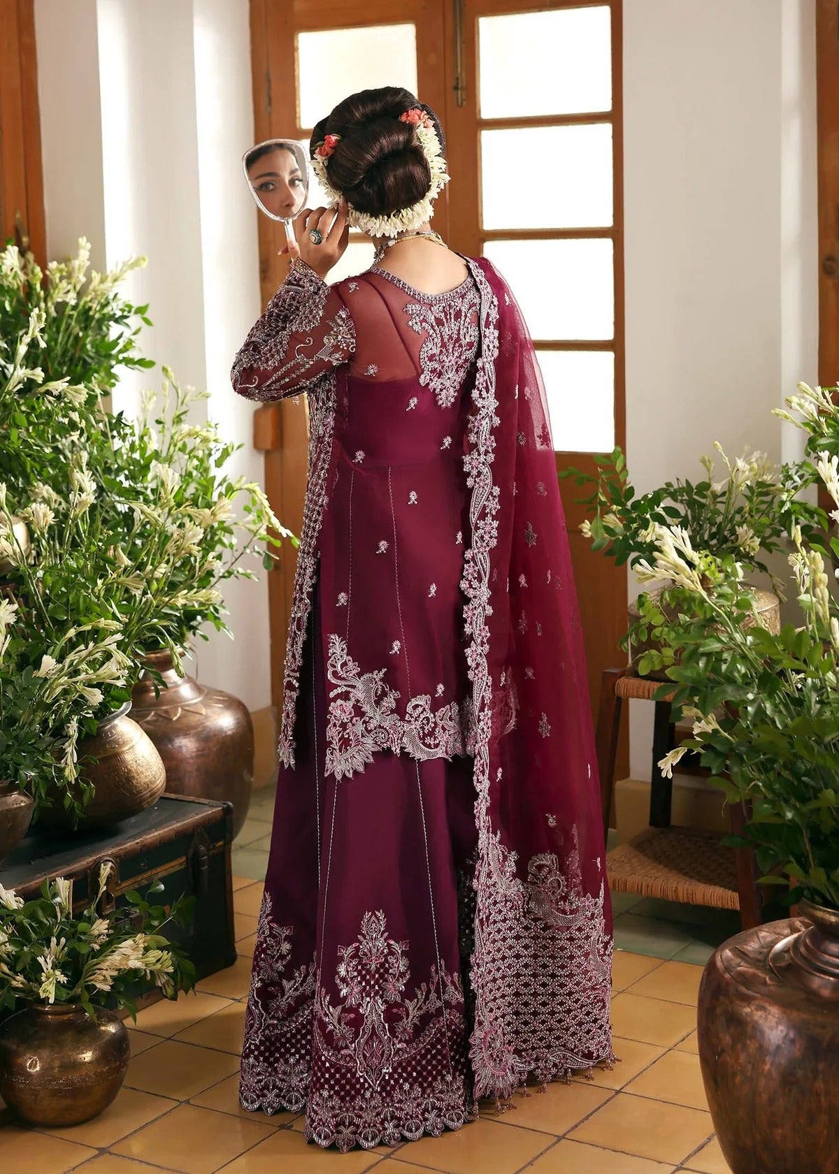 Regal imperial plum suit with hand-embellished organza panels, ornate borders, embroidered dupatta, and trouser for timeless festive elegance.