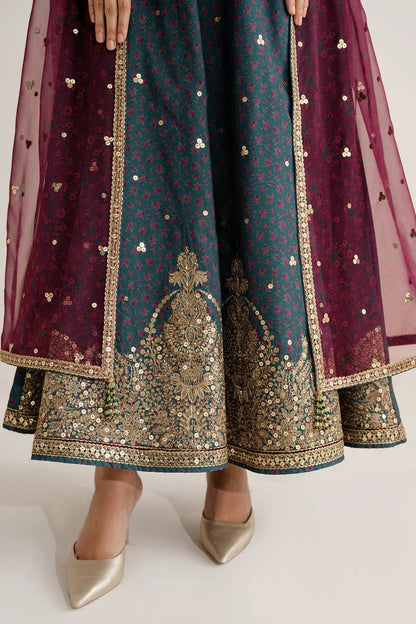 Discover UR-7058: a premium embroidered raw silk suit with chiffon dupatta and elegant borders. Perfect for formal, festive, or party occasions. Shop now!