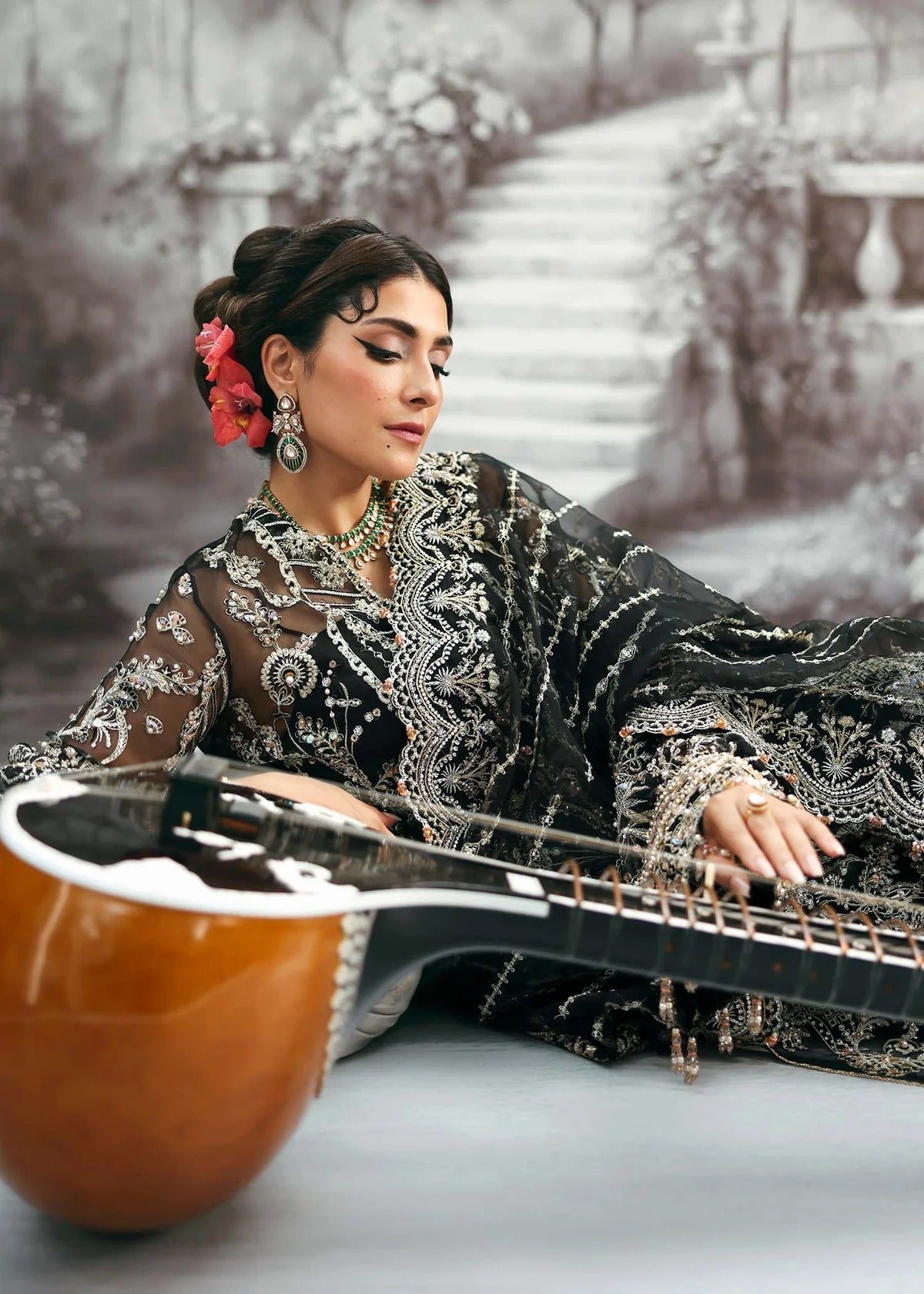 Majestic onyx noir suit with hand-embellished organza panels, refined borders, embroidered dupatta, and sleek trouser for timeless evening elegance.