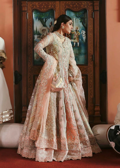 Stunning jewel-toned lehenga suit with hand-embellished shirt, embroidered borders, and organza dupatta for a regal festive look.