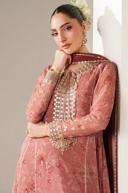 Digitally printed chiffon suit with embroidered borders & dupatta. Features rawsilk bottom for a rich, elegant look. Perfect for formal & festive wear.