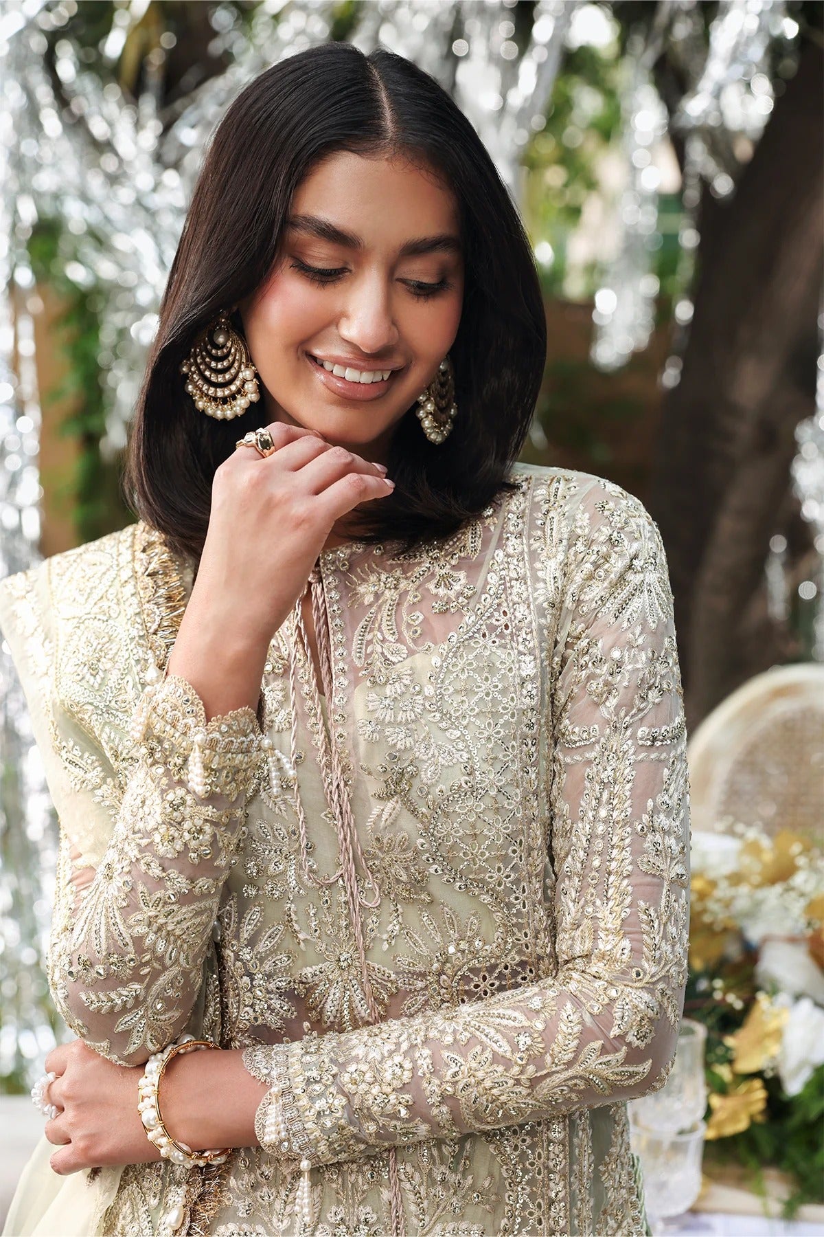 Stunning sea green and pink organza dress with rich embroidery, panels, dupattas & dyed trouser. Perfect for weddings or festive events. Premium quality.