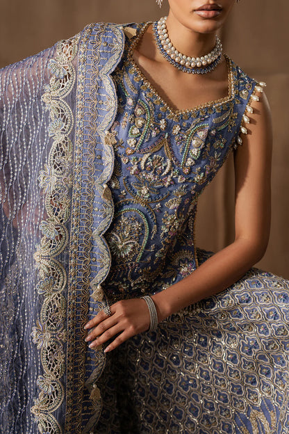 Majestic sapphire sharara set with intricate hand embellishment and metallic embroidery. Paired with an elegant dupatta for a bold festive look.