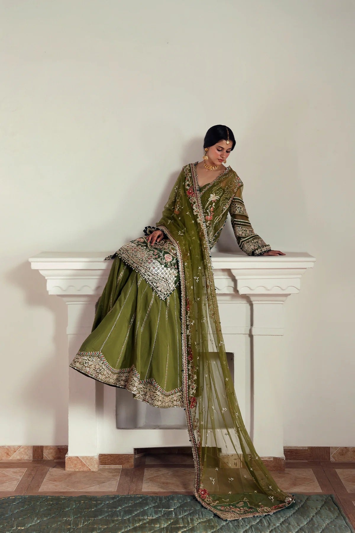 Elegant olive net and green viscose silk embroidered panels, sleeves, dupatta, and trousers with detailed borders for a graceful and stylish custom outfit.
