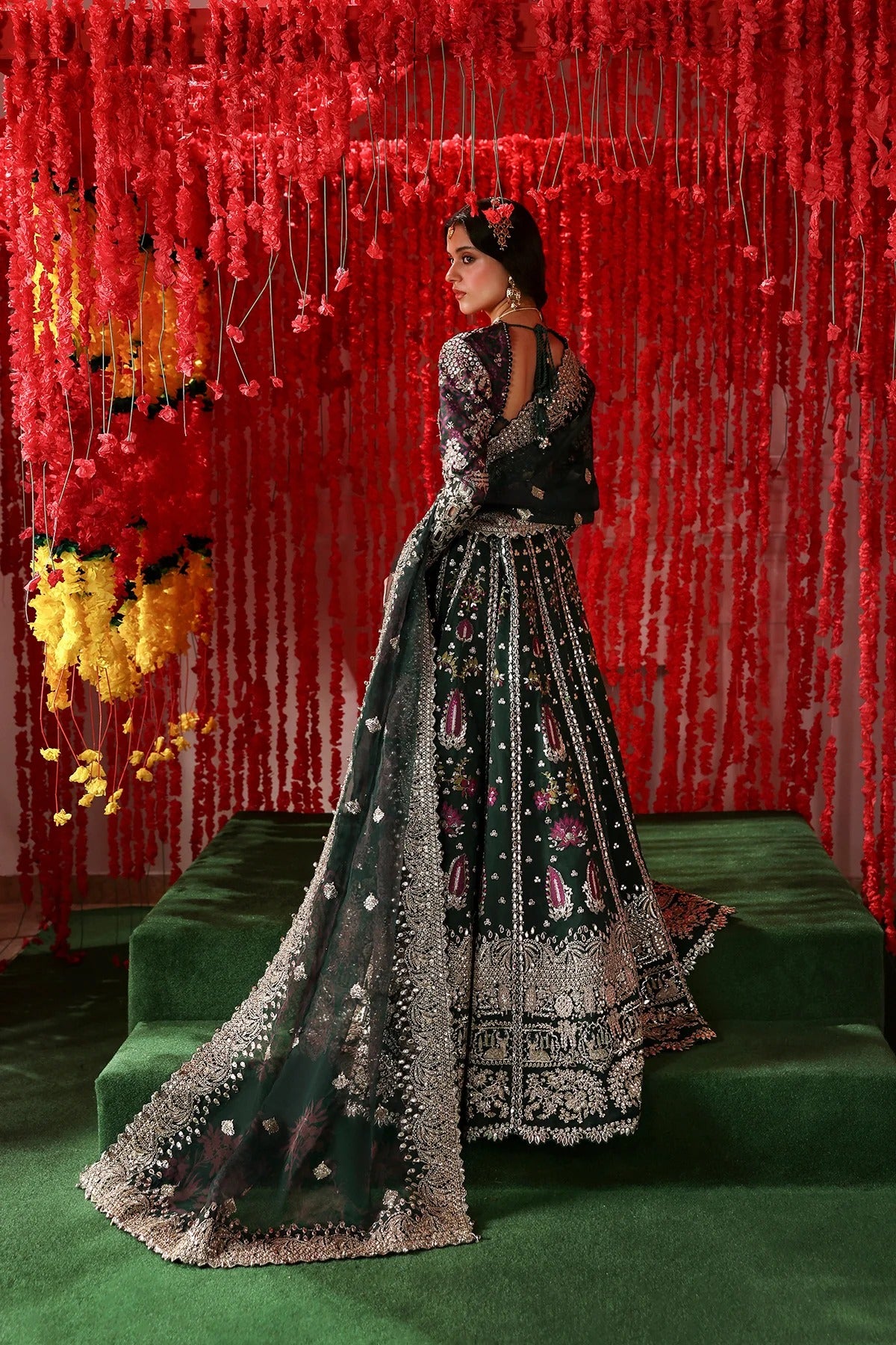 Stylish dark green raw silk and organza outfit with digital prints, embroidery, dupatta, and dyed trouser. A luxe pick for festive and formal wear.