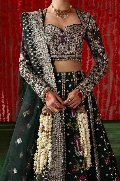 Stylish dark green raw silk and organza outfit with digital prints, embroidery, dupatta, and dyed trouser. A luxe pick for festive and formal wear.