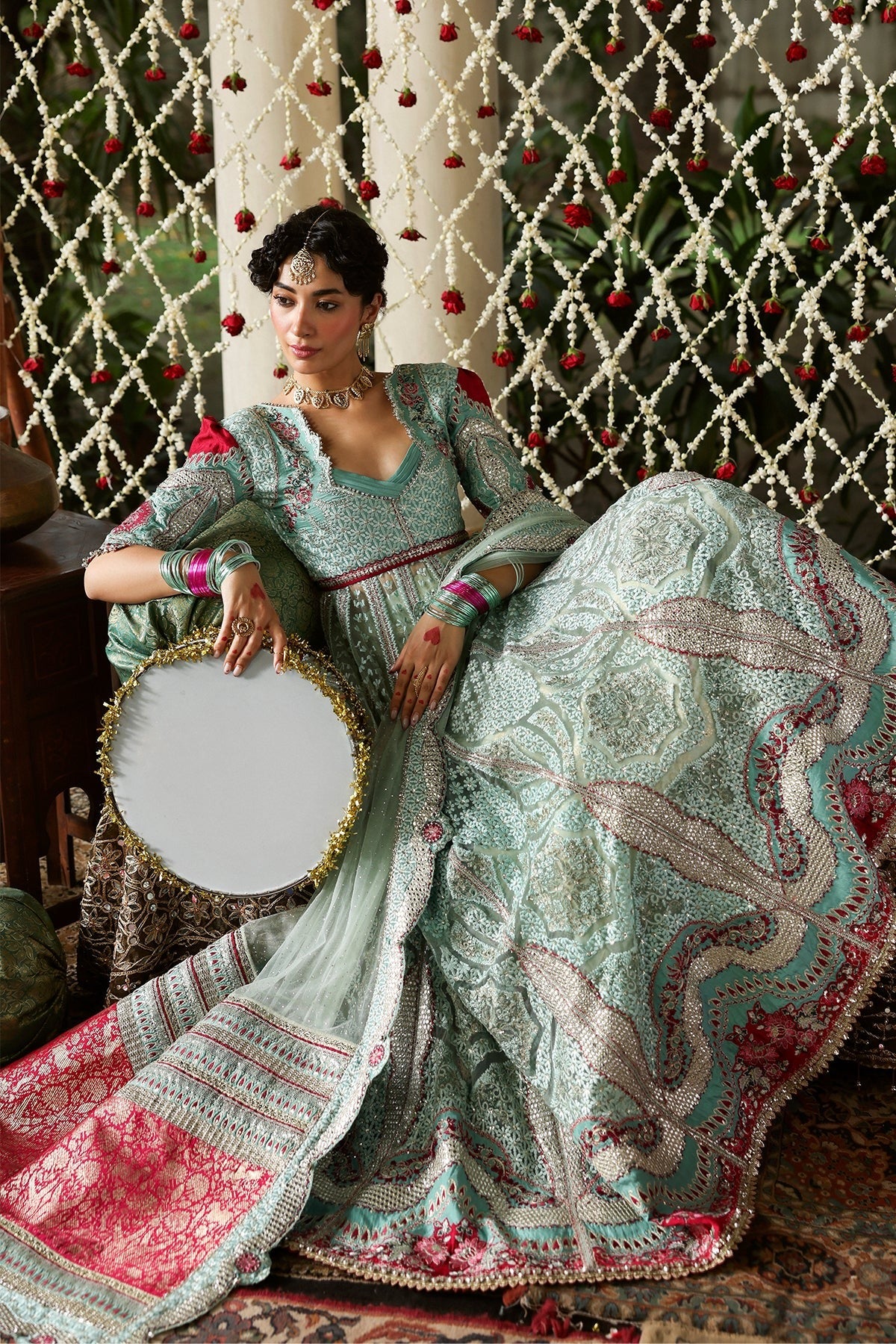 Luxurious dark aqua and red raw silk embroidered panels, sleeves, borders, and net dupatta with diamond accents for a stunning, elegant custom outfit creation.