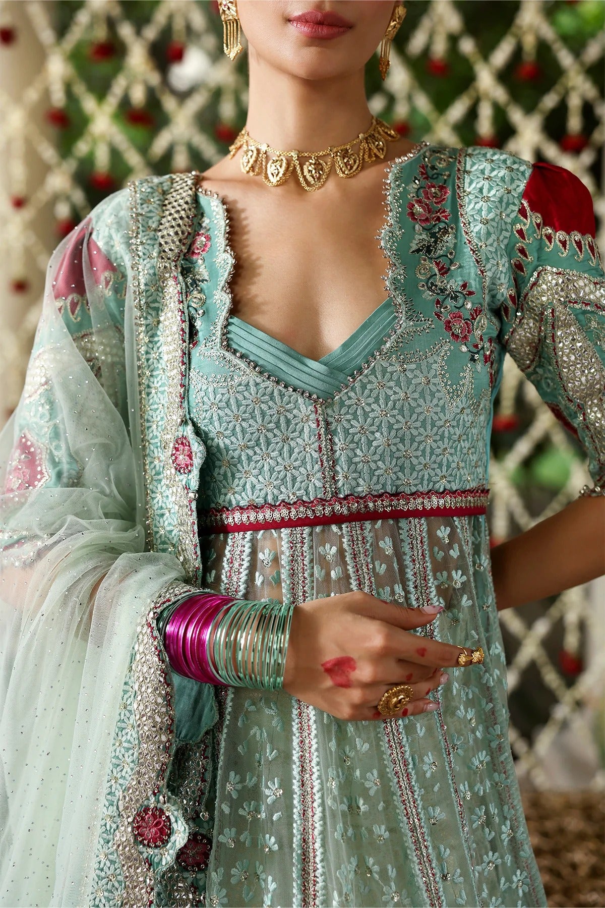 Luxurious dark aqua and red raw silk embroidered panels, sleeves, borders, and net dupatta with diamond accents for a stunning, elegant custom outfit creation.