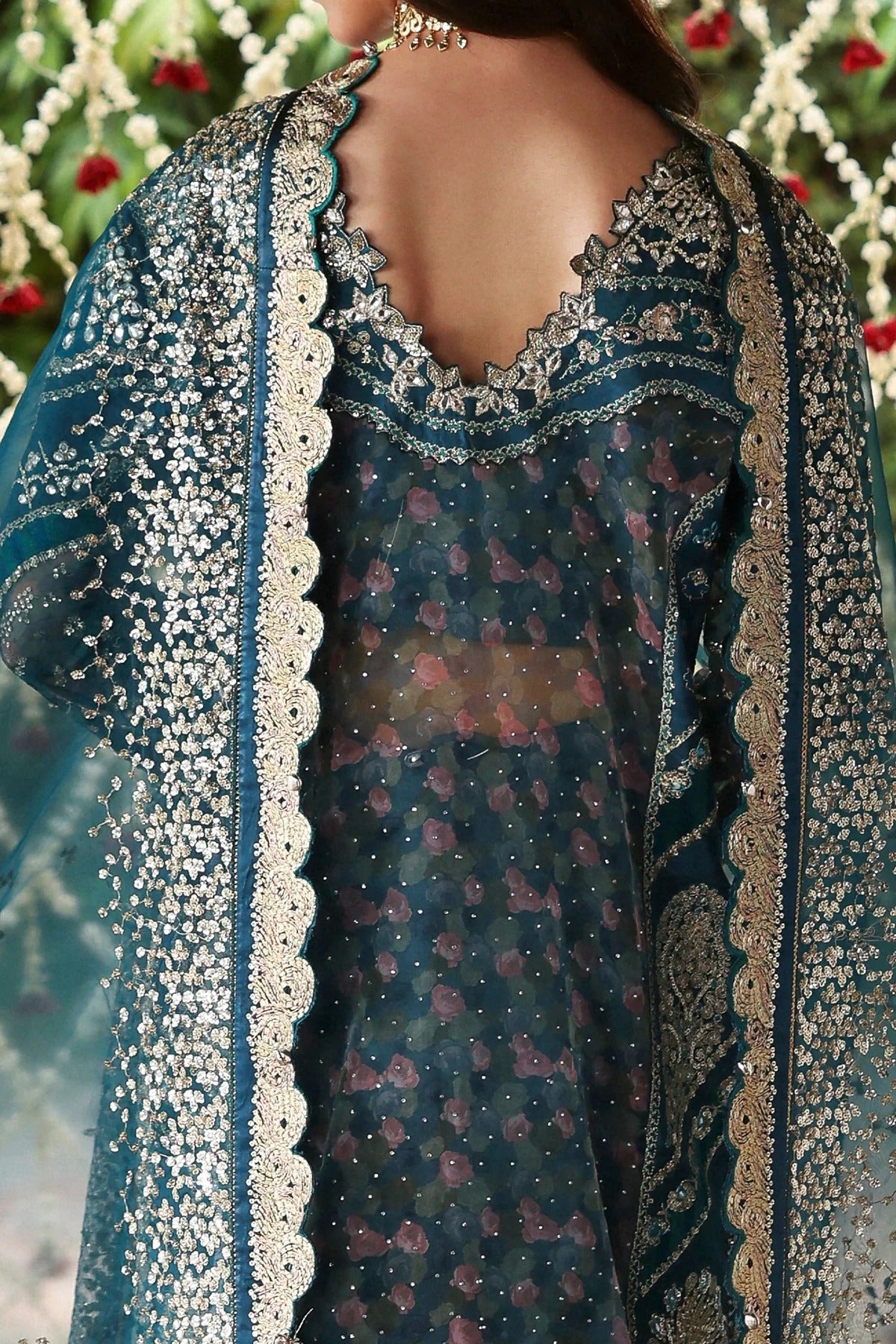 Shop sea green organza and raw silk fabric with intricate digital prints, embroidered sleeves, borders, patches, and dupatta for a stunning custom dress design.