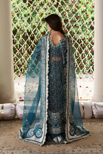 Shop sea green organza and raw silk fabric with intricate digital prints, embroidered sleeves, borders, patches, and dupatta for a stunning custom dress design.