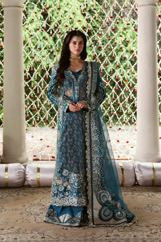 Shop sea green organza and raw silk fabric with intricate digital prints, embroidered sleeves, borders, patches, and dupatta for a stunning custom dress design.
